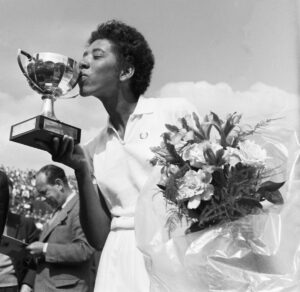 althea gibson kisses the cup she was rewarded with after having won the french international tennis championships in paris getty